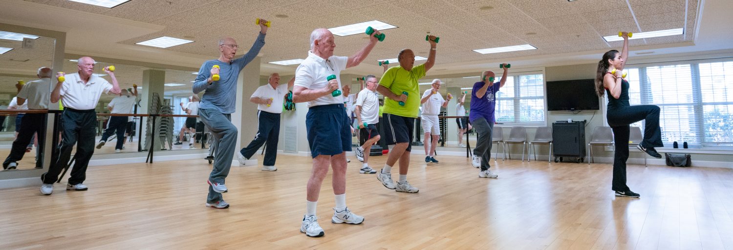 Group fitness class with trainer