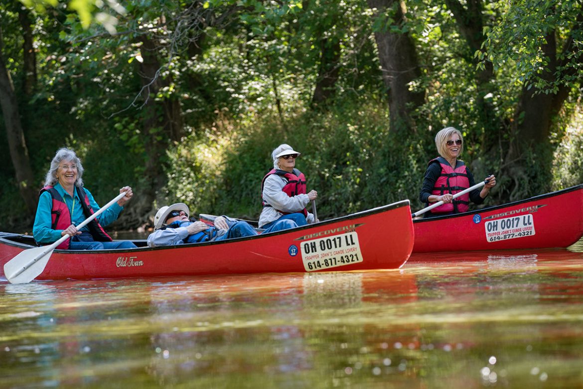Residents canoeing on the river