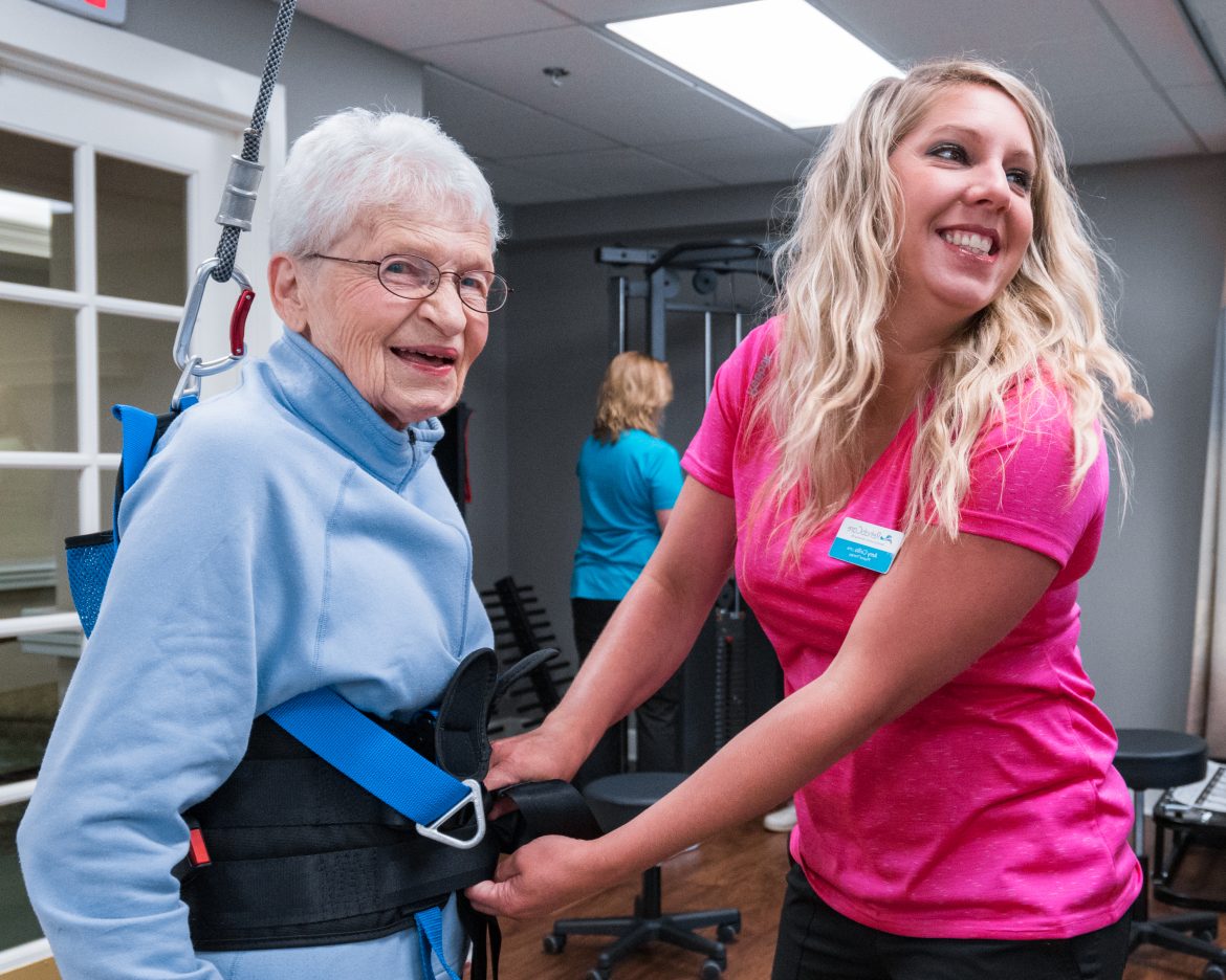 A resident working with a Friendship Village wellness team member