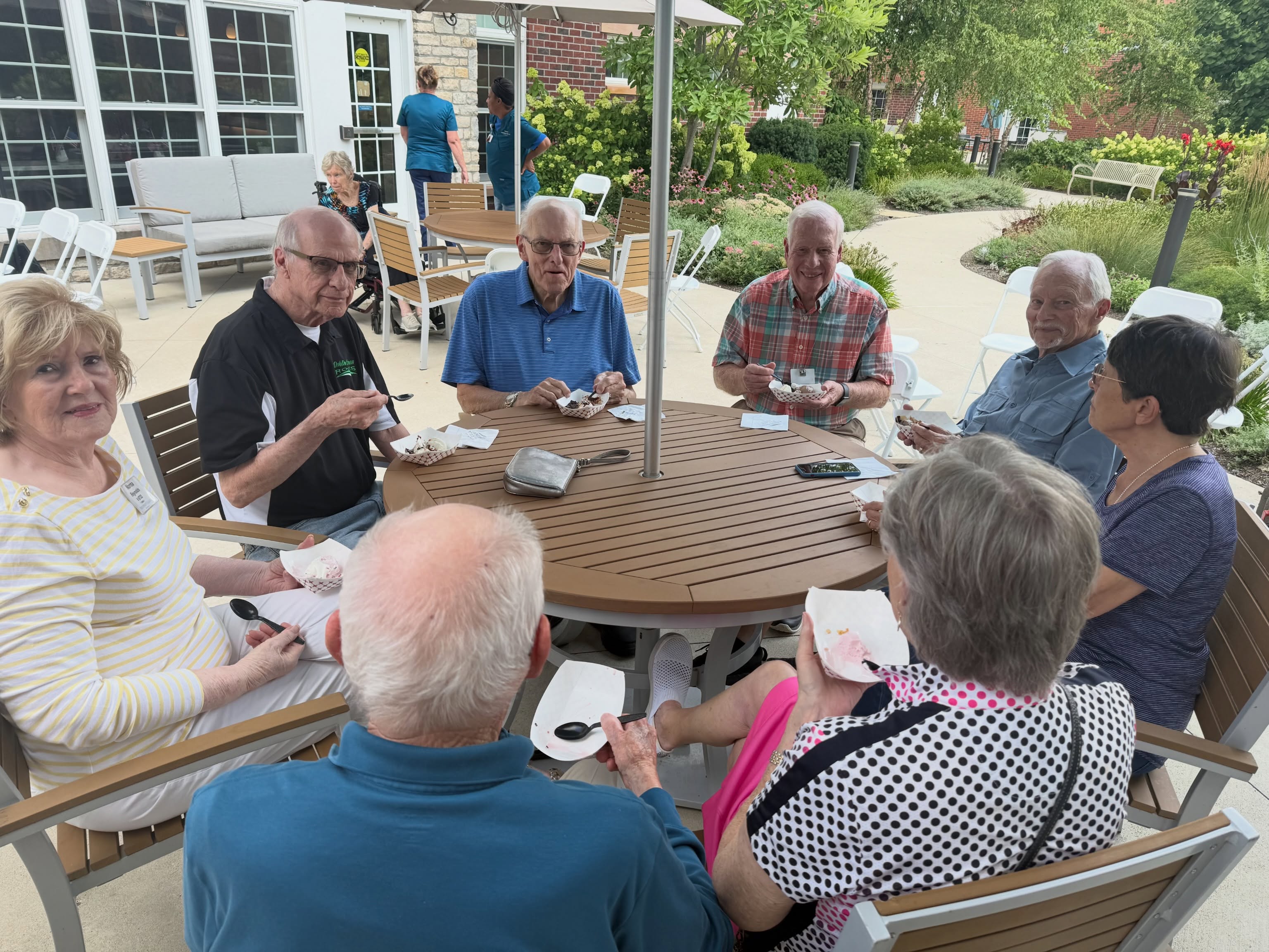 Residents gathered outdoors on the patio