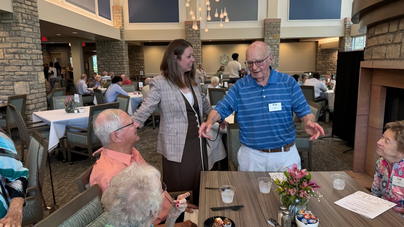 Residents greeting one another at a reception